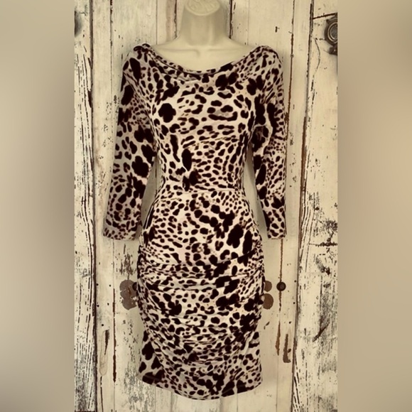 Jennifer Lopez Dresses & Skirts - New J Lo Leopard Print Sexy fitting Dress. Never worn but the tags were removed